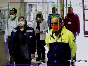 A screen shows a thermal imaging system taking the corporal temperature of health workers inside a public hospital to identify people potentially infected with the coronavirus disease (COVID-19) in Valparaiso, Chile April 23, 2020.