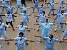 Nurses participate in a Zumba aerobic fitness program as a way of helping them to cope with working situations during the coronavirus disease (COVID-19) outbreak within the Infectious Disease Unit grounds of the Kenyatta National Hospital in Nairobi, Kenya May 28, 2020.