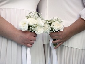 Files: A same-sex couple takes part in a wedding ceremony