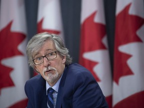 Privacy Commissioner Daniel Therrien speaks during a news conference in Ottawa, Tuesday, December 10, 2019. Canada's privacy commissioner has released a framework for governments on smartphone apps used to help trace a person's contacts if they're diagnosed with COVID-19. Daniel Therrien says the collected data should be destroyed when the pandemic ends.