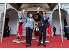 In this photo released by the Taiwan Presidential Office, Taiwanese President Tsai Ing-wen, left, waves with Vice President Lai Ching-te after their inauguration ceremony on Wednesday, May 20, 2020.
