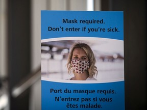 A file photo of a mask advisory sign at an OC Transpo station.