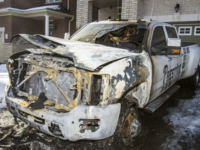 A burned out tow truck in front of a home on Collin Ct. in Richmond Hill, Ont. on Monday December 23, 2019.