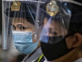 Security personnel are seen wearing face masks and face shields at a train station on the first day of relaxed quarantine measures on June 1, 2020 in Quezon city, Metro Manila, Philippines. The Philippines on Monday eased one of the world's longest and strictest lockdowns in the world to curb the spread of the coronavirus, even as cases of the virus in the country continue to rise. The 80-day lockdown in parts of the country has left millions of Filipinos jobless and hungry, and even as free mass testing for COVID-19 remains absent in most parts of the country, there has been a spike in reported cases in the past week. The Philippines' Department of Health has so far reported 18,086 cases of the coronavirus in the country, with at least 957 recorded fatalities.