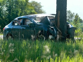 Fatal single car collision on Carling Avenue, west of Moodie Drive, Friday. Julie Oliver/POSTMEDIA