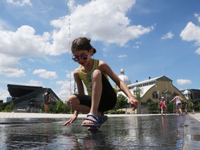 Naomi Petrie plays in the water features at TD Place in Ottawa.