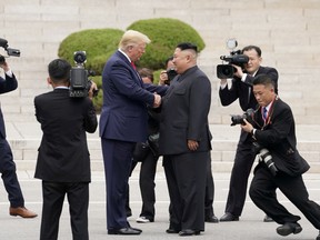 File picture of U.S. President Donald Trump meeting North Korean leader Kim Jong Un at the demilitarized zone separating the two Koreas, in Panmunjom, South Korea, June 30, 2019.
