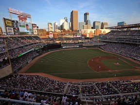 Fans watch as the Minnesota Twins play the New York Yankes at Target Field in Minneapolis, Minnesota, July 2, 2013.