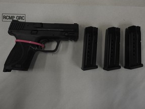 A gun and bullet clips seized in a firearms trafficking investigation last Wednesday