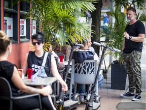People enjoying the beautiful weather on the patio at the Wellington Diner after COVID-19 restrictions were lifted, allowing restaurants to open socially distanced patio space for patrons. Wellington Diner owner Jeffrey Frost was greeting guests Sunday.