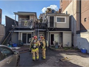 Ottawa Fire Service firefighters at the scene of a fire in a duplex at 140 Clarence St. on Saturday