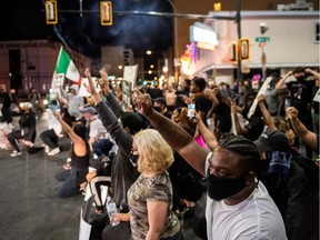 People shout slogans and hold placards as they take part in a "Black lives matter" rally in Las Vegas in response to the recent death of George Floyd in police custody.