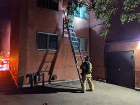 Firefighters work on a smoky fire 248 Guigues St. Fire contained to one unit on the 2nd floor of a 4 storey residential building. No reported injuries. Photo by Scott Stilborn via Twitter