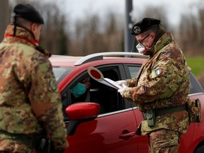 FILE PHOTO: Members of the Italian army wearing protective face masks.