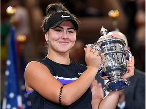Canada's Bianca Andreescu shows off the U.S. Open women's singles championship trophy after defeating Serena Williams of the U.S. in the final last Sept. 7.