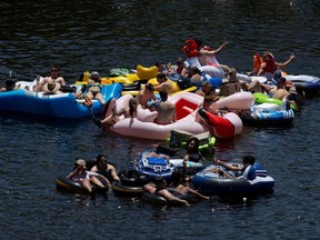 People go tubing on Salt River amid the outbreak of the coronavirus disease (COVID-19) in Arizona, U.S., June 27, 2020.