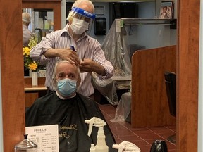 Leonard Meagher gets his first trim since February on Monday from Tony El Haddad at Francesco's in Carlingwood Mall.