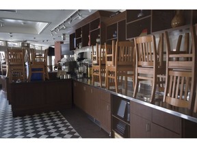 Chairs are seen on the counter of a closed restaurant in Whistler, B.C., on May 15, 2020. Statistics Canada will provide a new snapshot today of the job market as it stood last month with expectations that figures will show a continued bleeding of jobs due to the COVID-19 pandemic. More than three million jobs were lost over March and April as restrictions to contain the spread of the novel coronavirus were put in place.