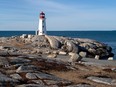 The lighthouse at Peggy's Cove, N.S., one of the favourite year-round destinations for visitors in Atlantic Canada, is seen on Monday, March 23, 2020.