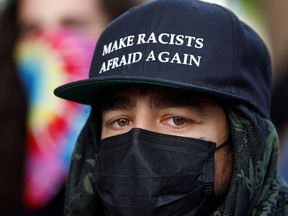 Protester wearing a mask due to the ongoing coronavirus disease (COVID-19) outbreak is seen during nationwide unrest following the death in Minneapolis police custody of George Floyd.