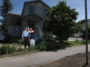 Don Crockford and Brenda MacKenzie in front of their house on Scott Street in Ottawa.