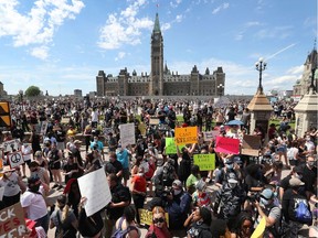 Thousands of people gathered to join a Black Lives Matter protest and a support march for march for George Floyd in downtown Ottawa Friday June 5, 2020.