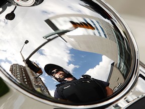 FILE: An Ottawa police officer is seen in a reflection.