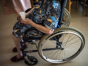 A file photo of an elderly woman in a wheelchair. Dr. Glen Kenny of the University of Ottawa says older individuals are at higher risk during heat waves because, unlike those who are younger, they get too warm and stay that way.