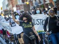 Marchers head down Elgin Street on their way to the city hall plaza on Saturday.