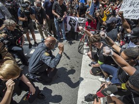 Toronto Police Chief Mark Saunders kneels on Toronto's Yonge Street with March For Change rally marchers in support and remembrance of George Floyd who was killed by police in Minneapolis , Friday June 5, 2020.