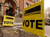 Voters outside a polling station during the federal election on Oct. 21, 2020.