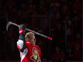 Daniel Alfredsson salutes the crowd after skating with the Ottawa Senators one last time in Ottawa on Thursday December 4, 2014.