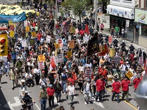 Protesters make their way around the corner of Yonge Street at Gerrard in Toronto during the G8/G20 protests.