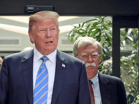 US President Donald Trump with National Security Advisor John Bolton at a G7 Summit in Canada on June 9, 2018.