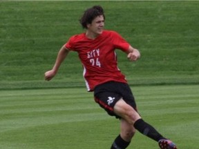 John Geerdes is shown playing on his Iowa City High School soccer team in the spring, shortly before he graduated and then enrolled at the University of Victoria. He was one of two 18-year-old UVic students killed Friday when a charter bus crashed carrying 45 students between the Vancouver Island communities of Port Alberni and Bamfield.