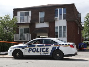Gatineau police set up a perimeter at 13 Mont-Bleu Blvd. in Gatineau Tuesday June 29, 2020. A baby's body was found behind an apartment building and a woman in her 20s was arrested.