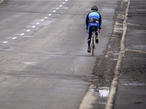 A cyclist travels along Carling Avenue. How can we make the roads safer for everyone?