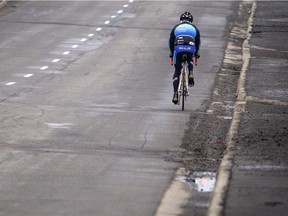 A cyclist travels along Carling Avenue.