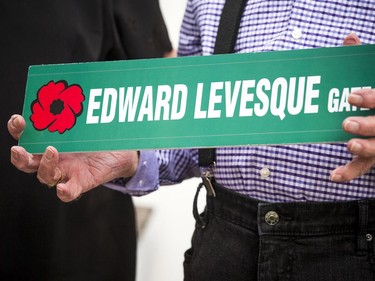 Ed Levesque held a sign that will be a street name in Arnprior, in honour of him.