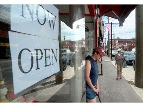 OTTAWA - MAY 19, 2020 -  People come in and out of J.D. Adam Giftware in the Glebe.