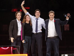 Happier times: Prime Minister Justin Trudeau and Sophie Gregoire-Trudeau are flanked by WE Day co-founders Craig Kielburger, left, and Marc Kielburger, right at an event in Ottawa.