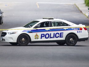 FILE: Ottawa police investigate a scene.