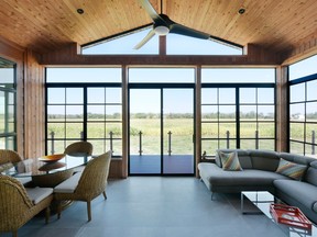 “Outdoor spaces are very important,” says Mark Kranenburg of Greenmark Builders, which built this sunroom for rural clients who wanted a connection to their farmland. “Over the past 10 years, most of the feedback we have had on the outdoor spaces comes down to people just being happier outside than inside.”