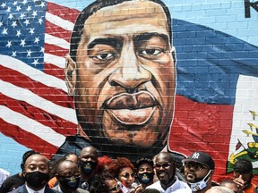 NEW YORK, JULY 13: Terrance Floyd (R), the brother of George Floyd, attends the unveiling of a mural depicting George Floyd on a sidewall of CTown Supermarket in the Brooklyn.
