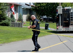 An OPP officer works to cordon off Lemay Circle in Rockland in a photo taken on Friday.