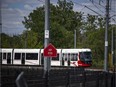 A June file photo of an LRT train making its way along the tracks near Tremblay Station.