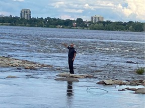 OTTAWA - July 23, 2020 - Ottawa Fire Services help rescue two men whose fishing boat stalled and entered the Aylmer hydro ruins which is a highly hazardous area with fast moving water.