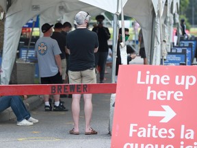 Lineups for testing at the COVID assessment centre at Brewer Arena Friday.