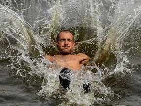 A man cools off in a splash.