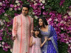 Indian film actor Abhishek Bachchan, his wife Aishwarya Rai and their daughter Aaradhya in a 2019 photograph taken at the wedding of Akash Ambani, the son of Reliance Industries chairman Mukesh Ambani, in Mumbai, India. Picture taken on March 9, 2019.